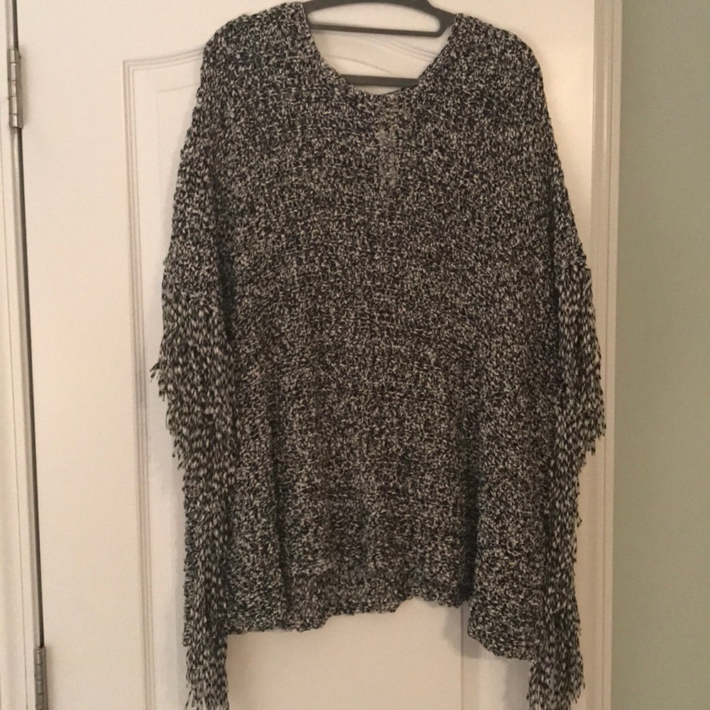 One size fits all, black and white fringe poncho